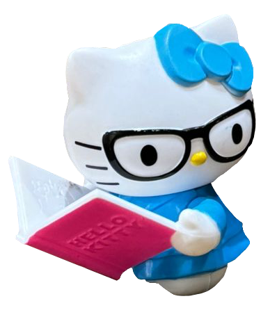 a hello kitty figurine. she's reading.
