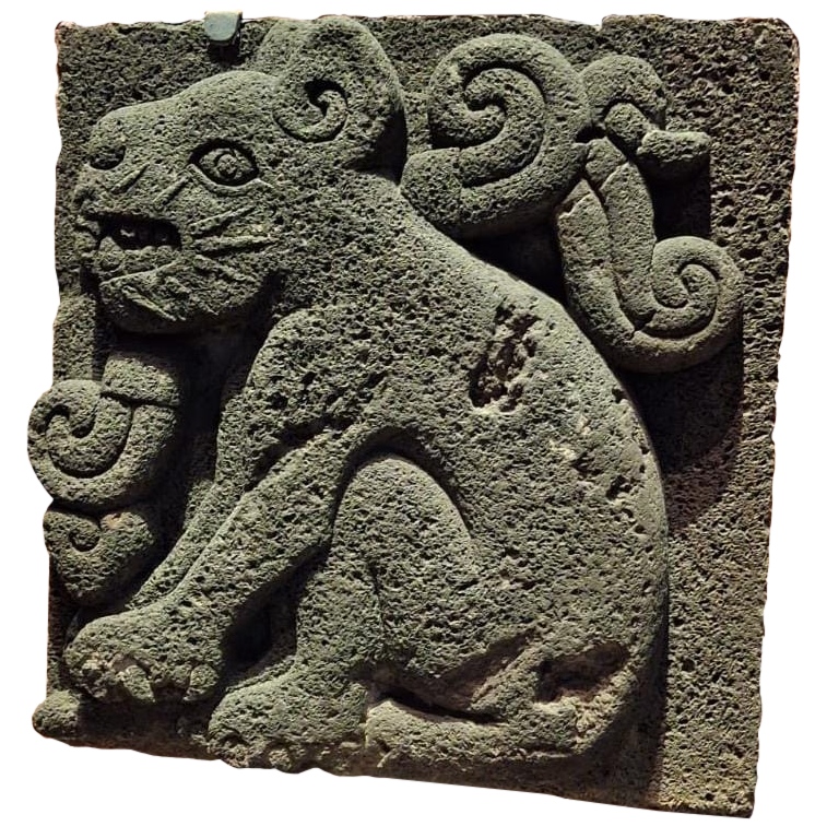 a gravestone depicting a jaguar or some feline. mexico.